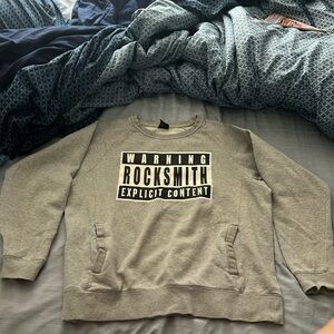 Mens L Rocksmith gray “WARNING EXPLICIT CONTENT” sweatshirt with front pockets.